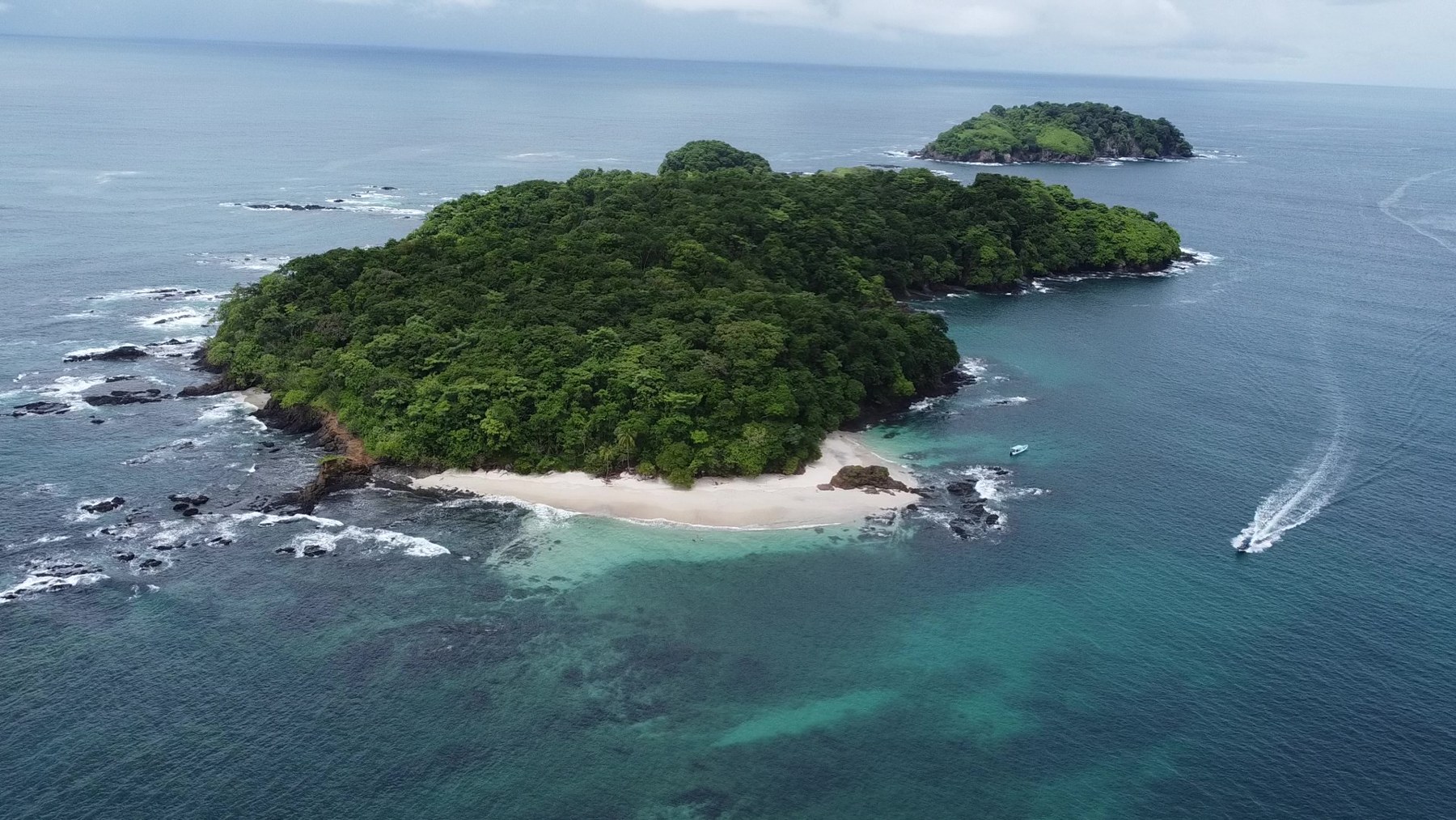 Aerial view of the island and turquoise waters at Caleta