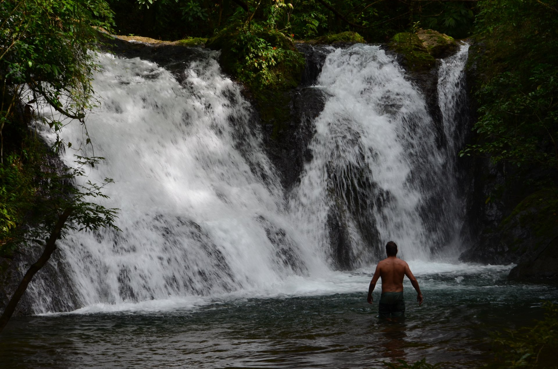 Water cascading over rocks into a forest pool in Mariato